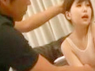 Japanese babe in transparent swimsuit rubs her nipples in Tokyo's XXX porn escape